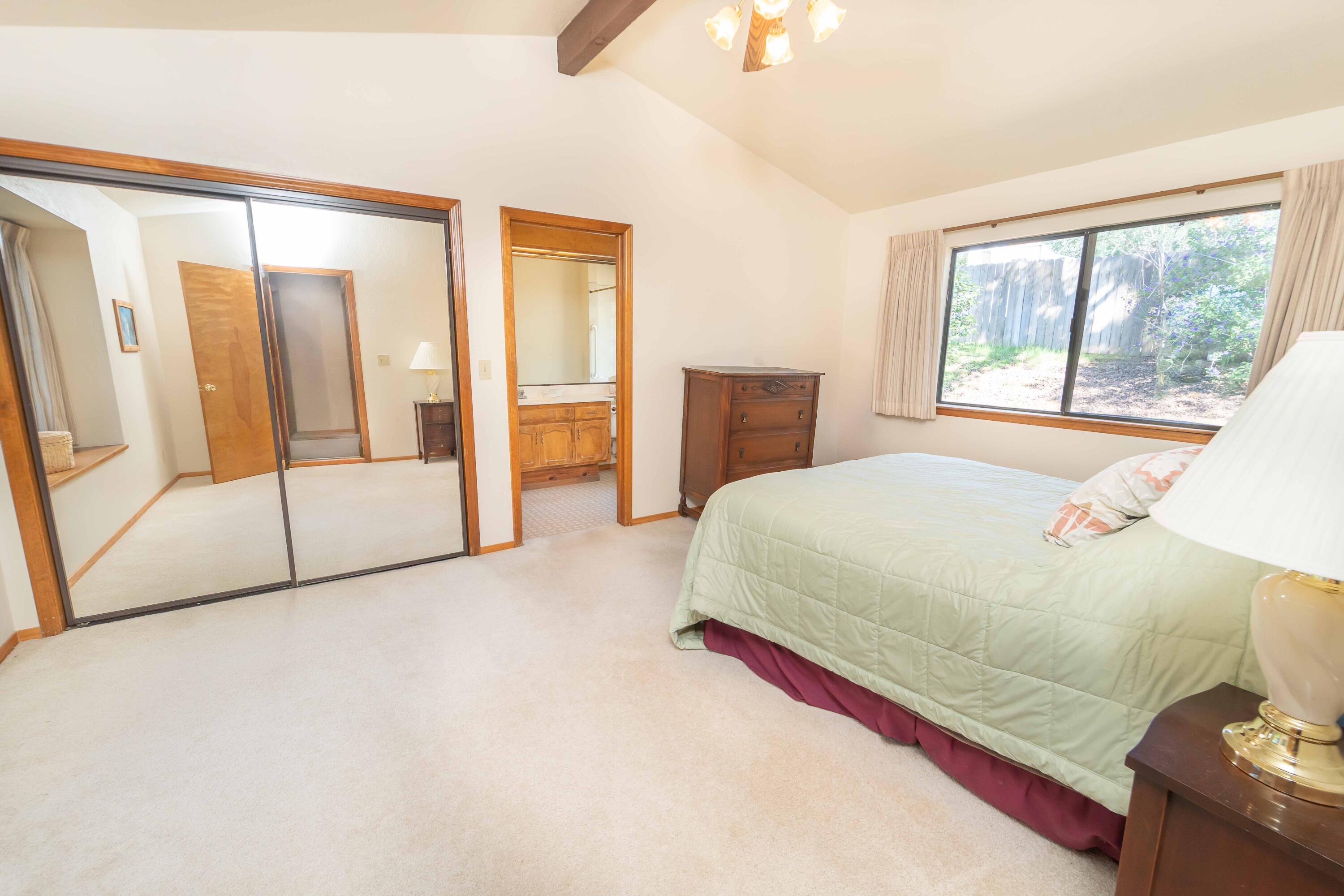40962 Oak Ridge Drive Three Rivers, CA 93271 - Photo 21 of 36 a spacious bedroom with a large bed and a large window