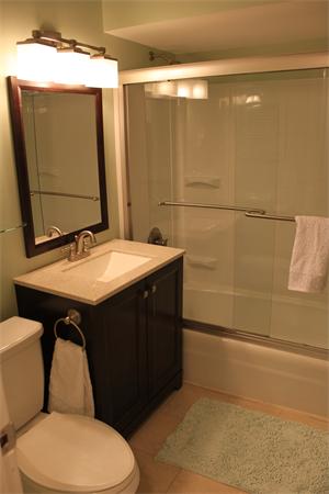 676 Sumner Avenue Springfield, MA 01108 - Photo 12 of 15 a bathroom with a sink mirror vanity and toilet