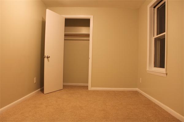 676 Sumner Avenue Springfield, MA 01108 - Photo 14 of 15 a view of an empty room with closet and closet