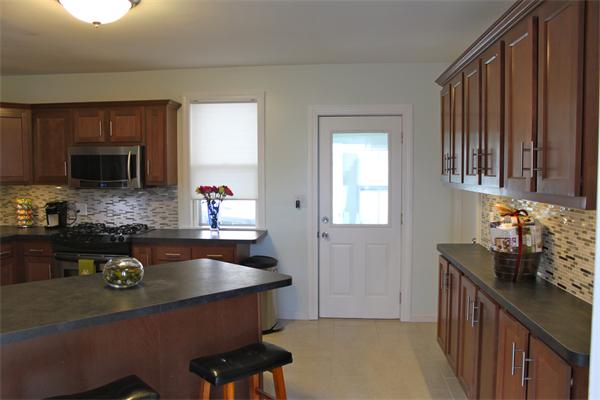 676 Sumner Avenue Springfield, MA 01108 - Photo 2 of 15 a kitchen with a sink appliances and cabinets