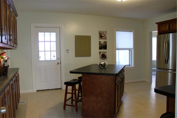 676 Sumner Avenue Springfield, MA 01108 - Photo 3 of 15 a view of a kitchen with furniture and a window