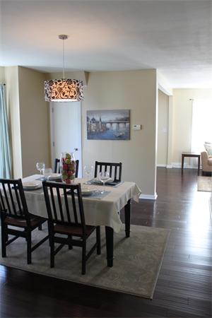 676 Sumner Avenue Springfield, MA 01108 - Photo 6 of 15 a view of a dining room with furniture and wooden floor