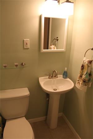 676 Sumner Avenue Springfield, MA 01108 - Photo 8 of 15 a bathroom with a toilet sink and mirror