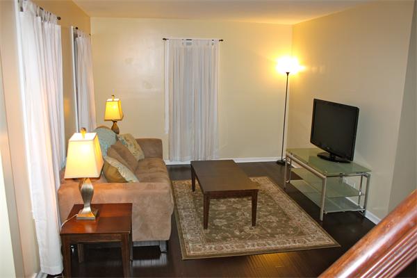 676 Sumner Avenue Springfield, MA 01108 - Photo 9 of 15 a living room with furniture and a flat screen tv