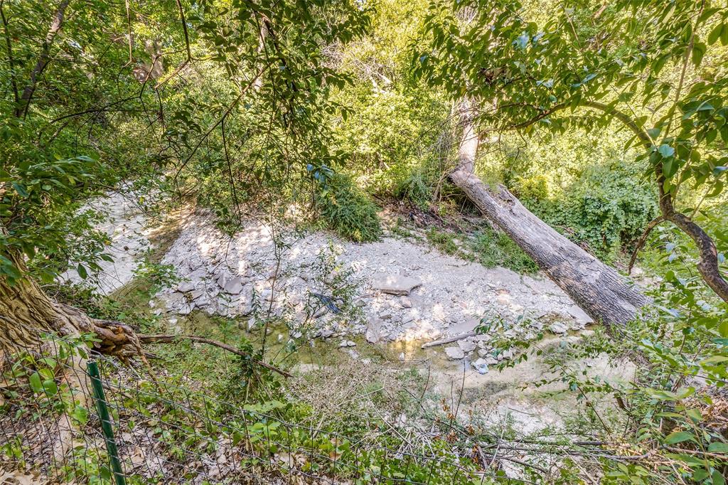2314 Springhill Drive Dallas, TX 75228 - Photo 26 of 27 Wooded creek in the backyard