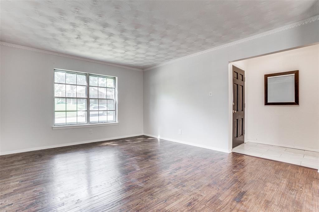 2314 Springhill Drive Dallas, TX 75228 - Photo 4 of 27 Formal living/bonus room at front of house for welcoming guests