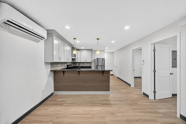 a view of kitchen and refrigerator