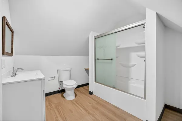 a bathroom with a sink toilet and shower