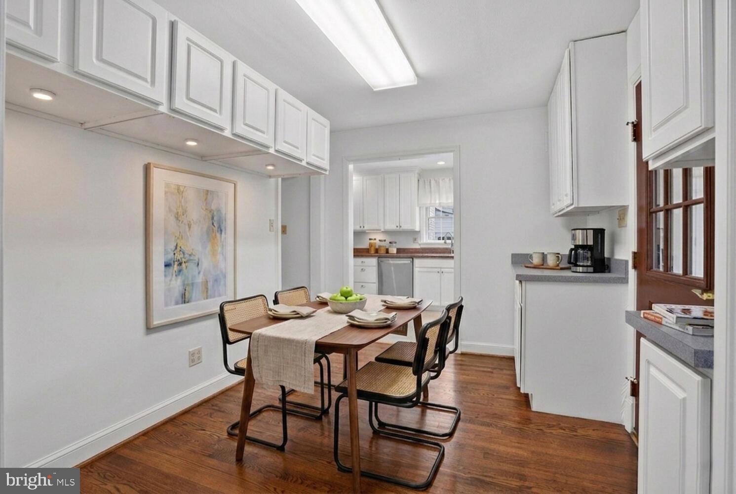2420 Cameron Mills Road Alexandria, VA 22302 - Photo 19 of 45 a view of a dining room with furniture and a kitchen view