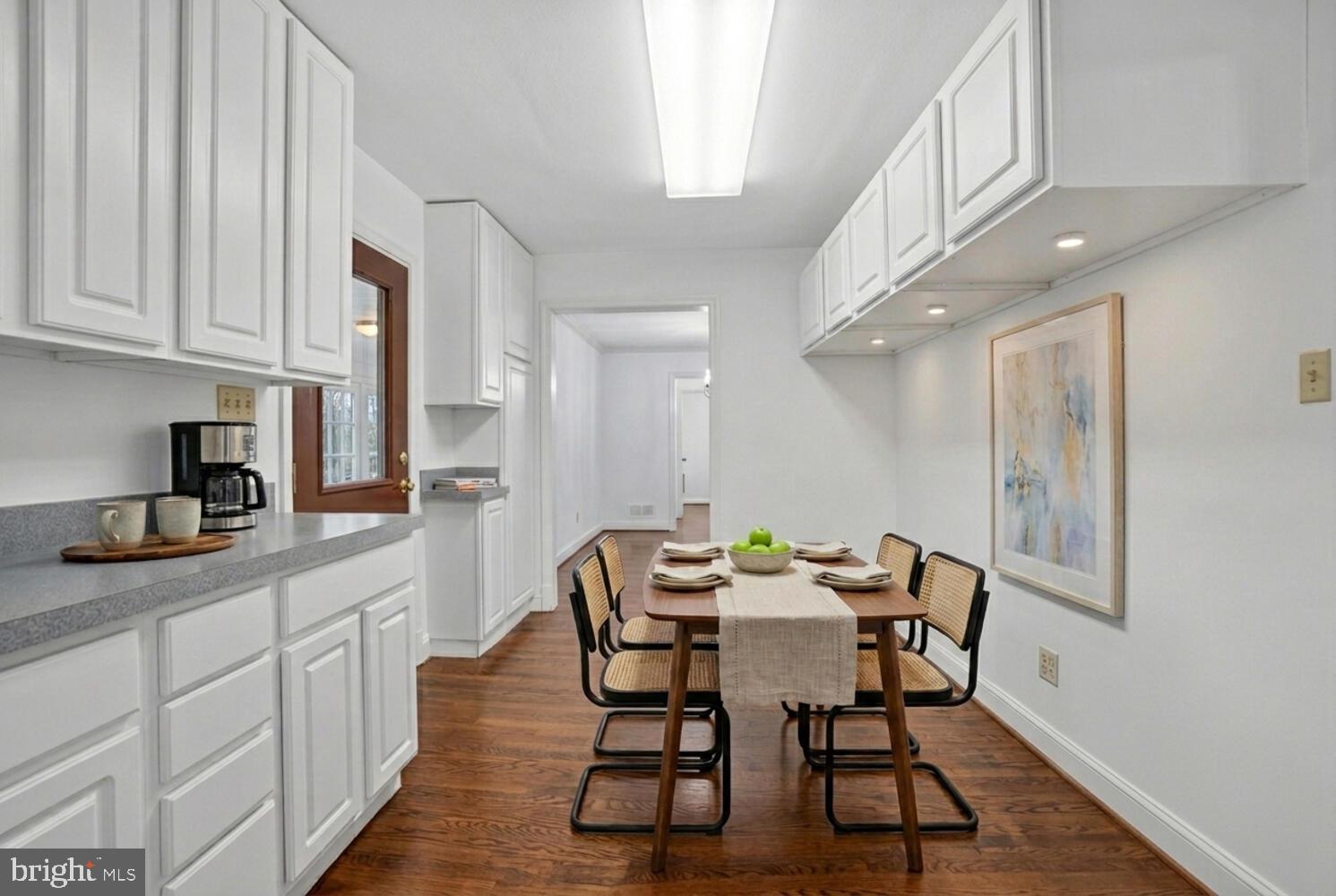 2420 Cameron Mills Road Alexandria, VA 22302 - Photo 20 of 45 a dining room with furniture and wooden floor