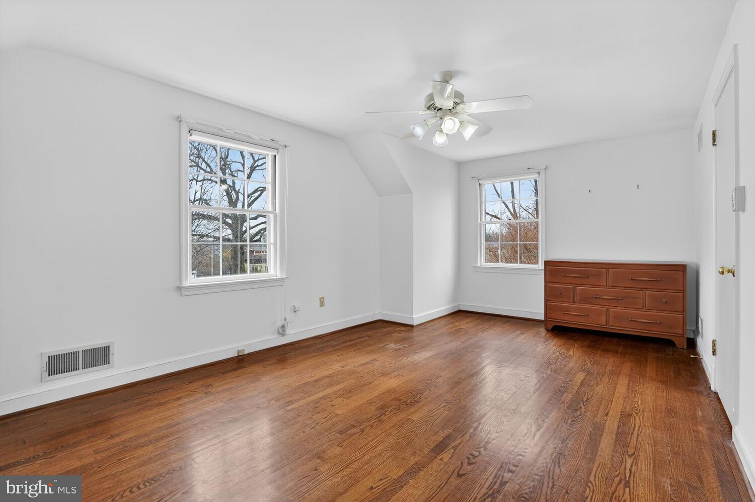 2420 Cameron Mills Road Alexandria, VA 22302 - Photo 28 of 45 a view of room with hardwood floor and ceiling fan