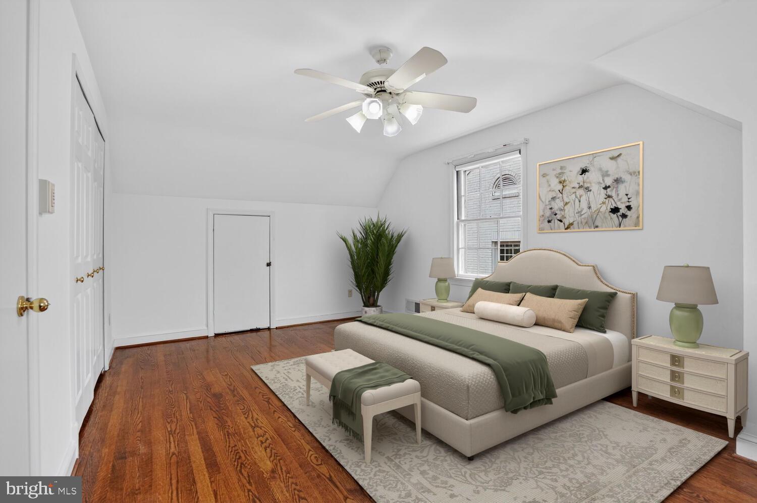 2420 Cameron Mills Road Alexandria, VA 22302 - Photo 29 of 45 a bedroom with bed and a chandelier