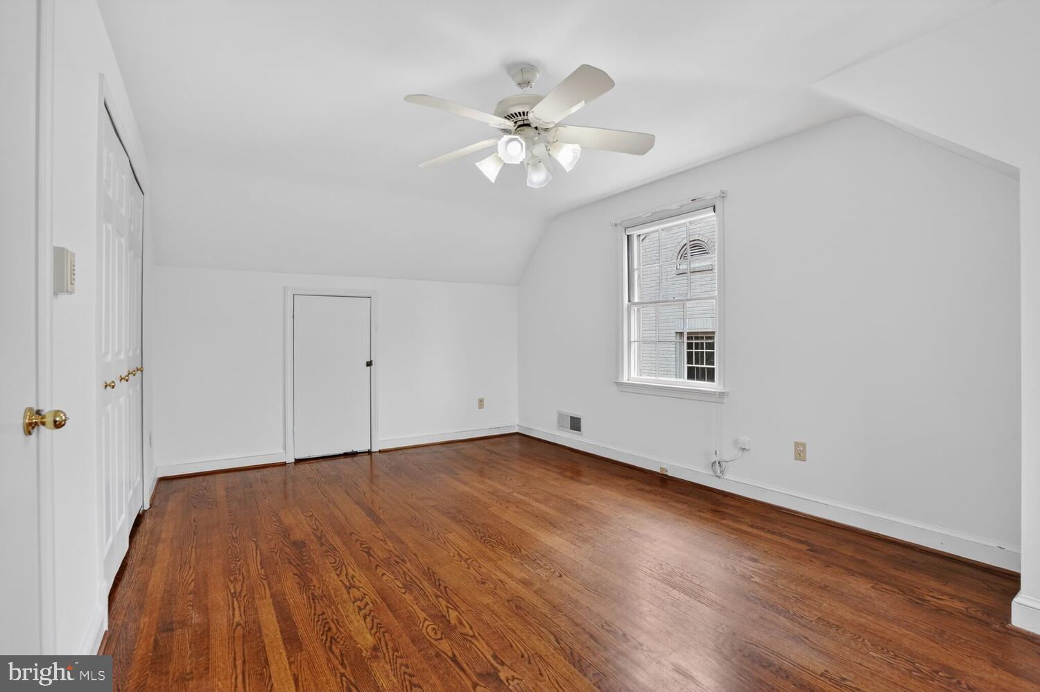 2420 Cameron Mills Road Alexandria, VA 22302 - Photo 30 of 45 wooden floor in an empty room with a window