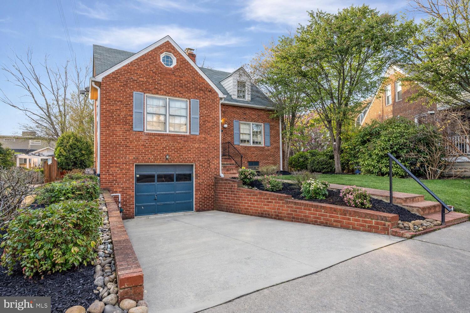 2420 Cameron Mills Road Alexandria, VA 22302 - Photo 3 of 45 a front view of a house with a garden