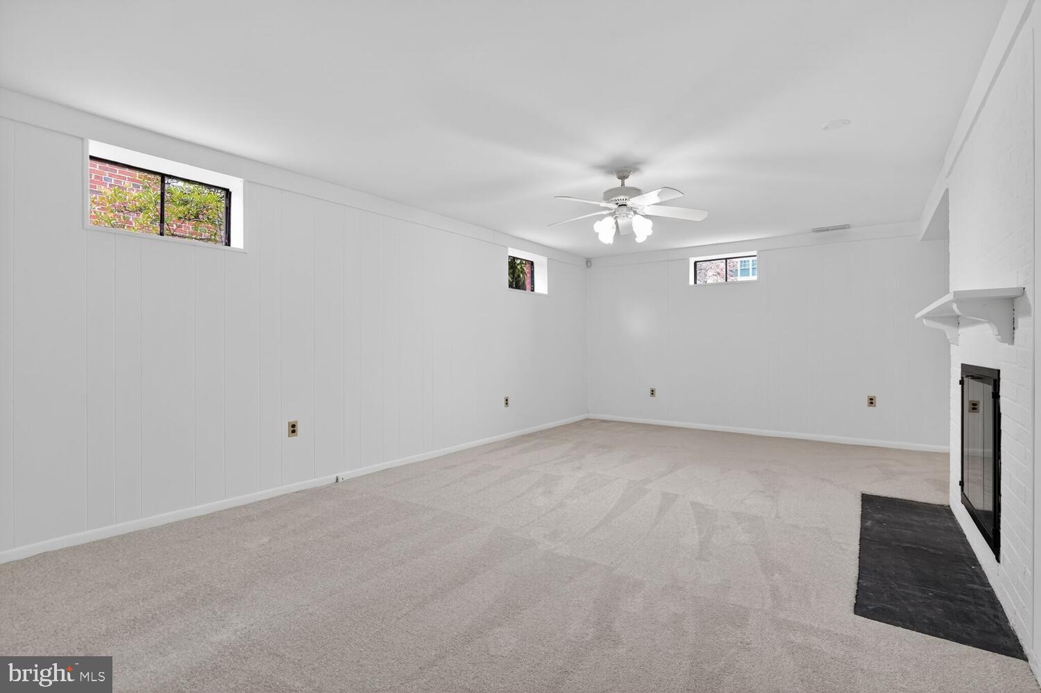 2420 Cameron Mills Road Alexandria, VA 22302 - Photo 38 of 45 a view of a room with a ceiling fan and a window
