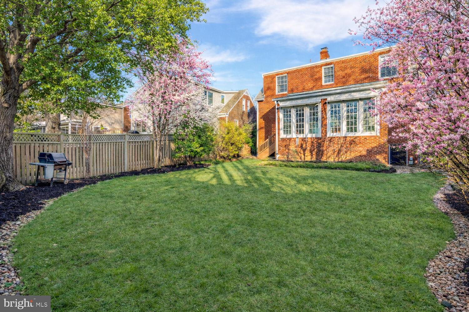 2420 Cameron Mills Road Alexandria, VA 22302 - Photo 43 of 45 a view of a house with a yard and sitting area