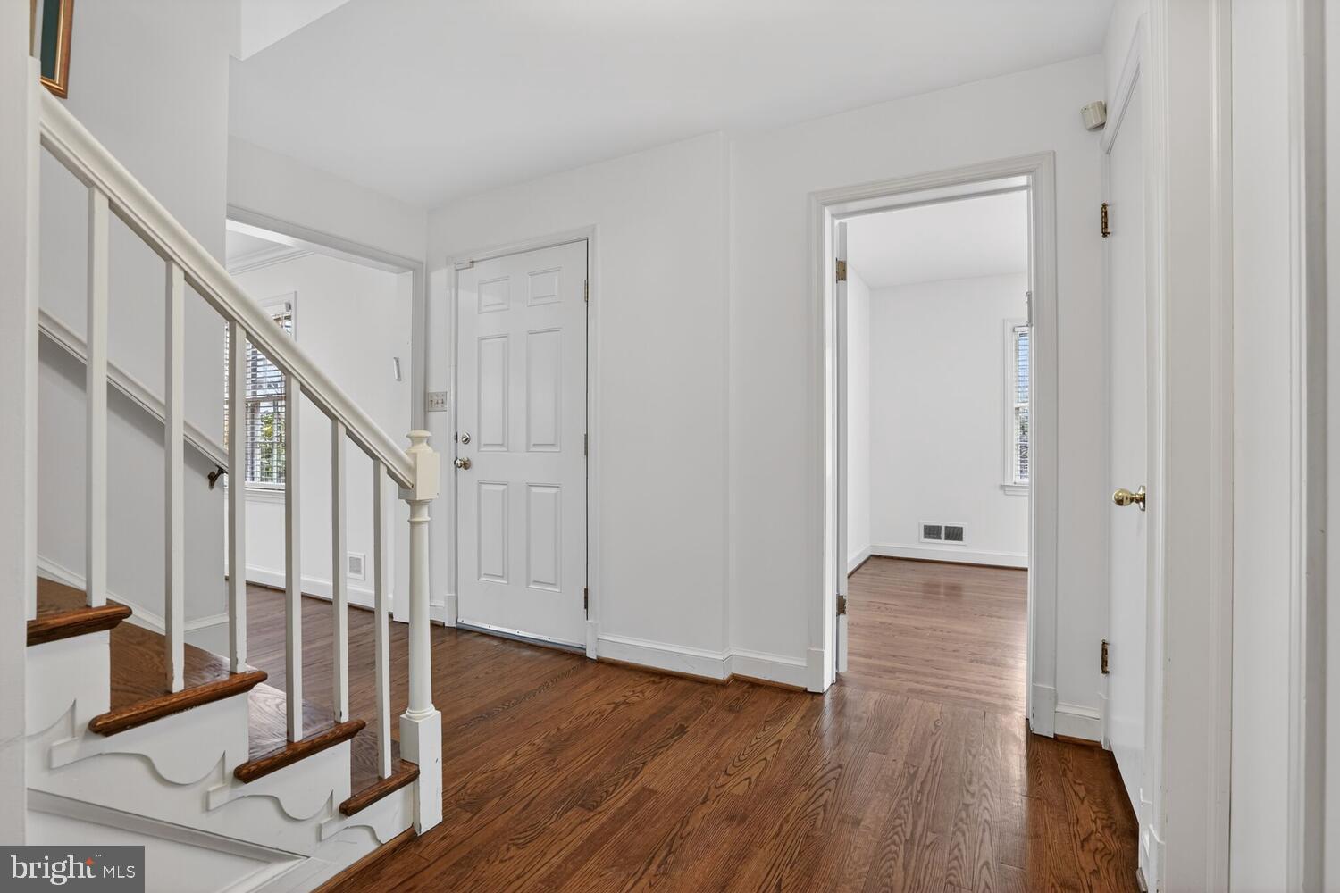 2420 Cameron Mills Road Alexandria, VA 22302 - Photo 5 of 45 a view of a hallway with wooden floor and entryway