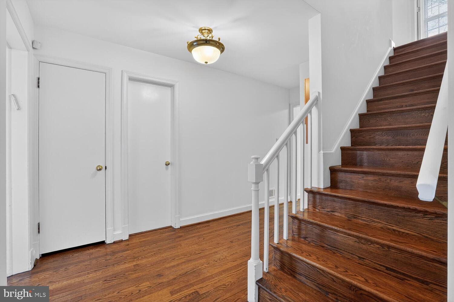 2420 Cameron Mills Road Alexandria, VA 22302 - Photo 7 of 45 a view of entryway and hall with wooden floor