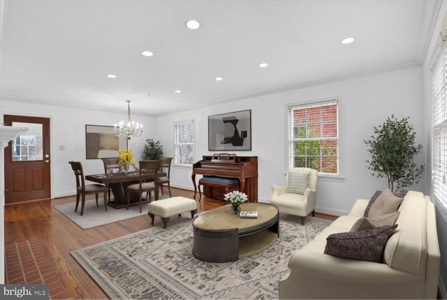 2420 Cameron Mills Road Alexandria, VA 22302 - Photo 8 of 45 a living room with furniture and a dining table with wooden floor