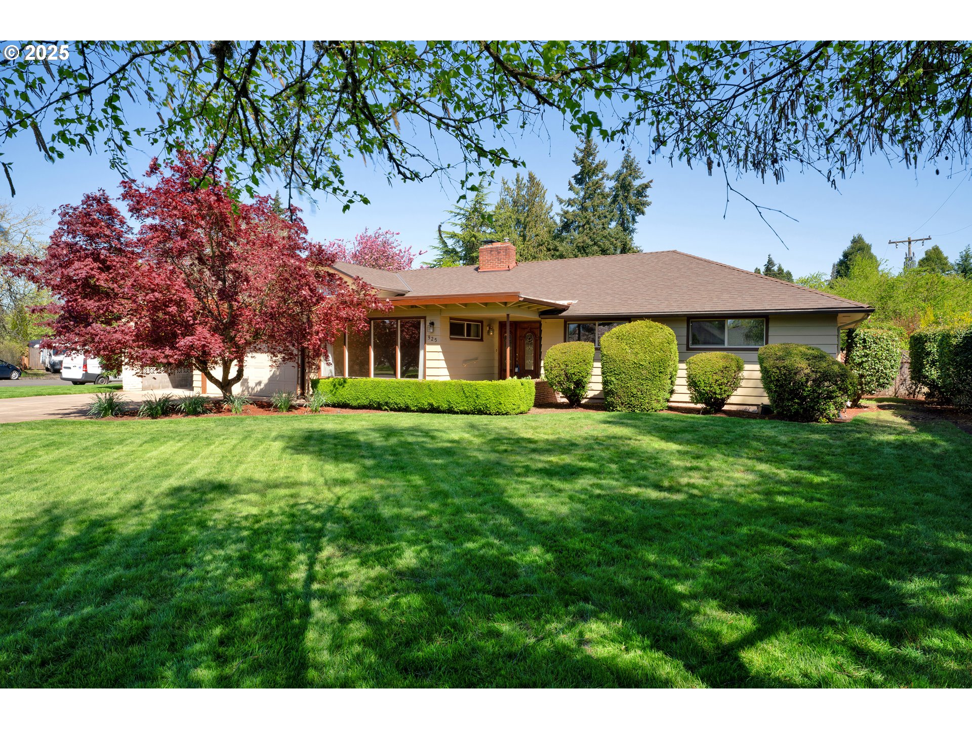 925 Ascot Drive Eugene, OR 97401 - Photo 1 of 44 a view of an house with backyard space and garden view