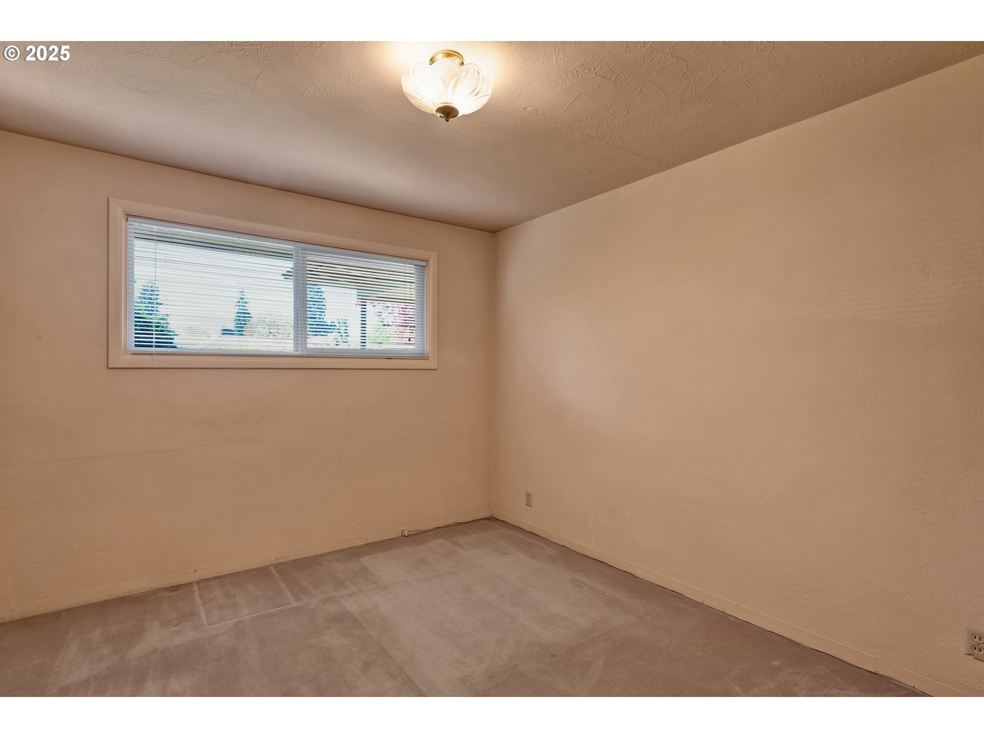 925 Ascot Drive Eugene, OR 97401 - Photo 25 of 44 a view of an empty room with a window