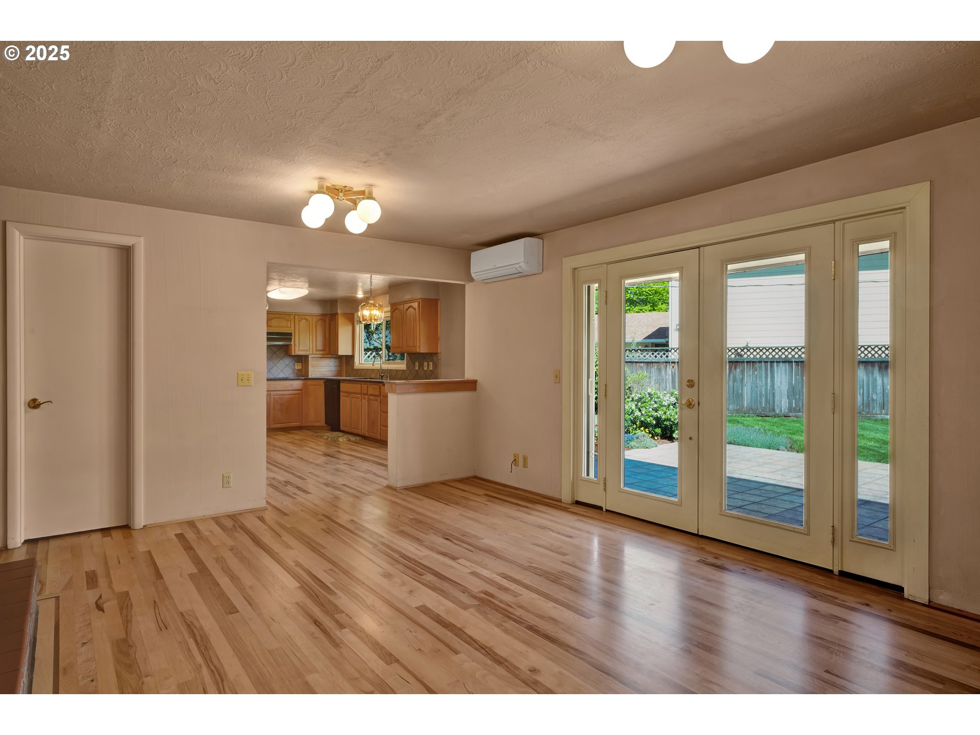 925 Ascot Drive Eugene, OR 97401 - Photo 9 of 44 a view of a kitchen with a fridge wooden floor and a kitchen
