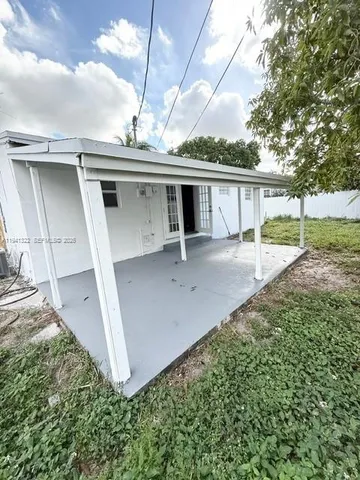 a house view with a backyard space