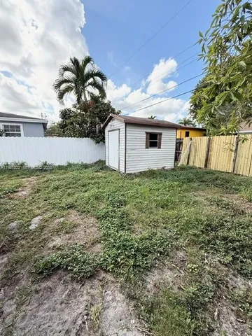 a view of front door and yard