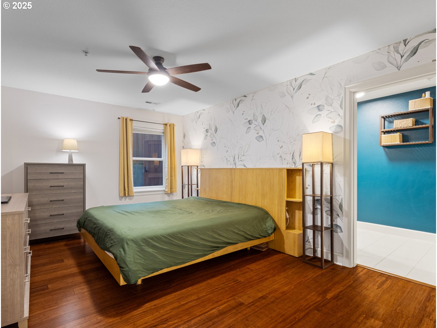 2013 Northeast 10th Avenue, Unit E Portland, OR 97212 - Photo 20 of 30 a bedroom with a bed and a ceiling fan