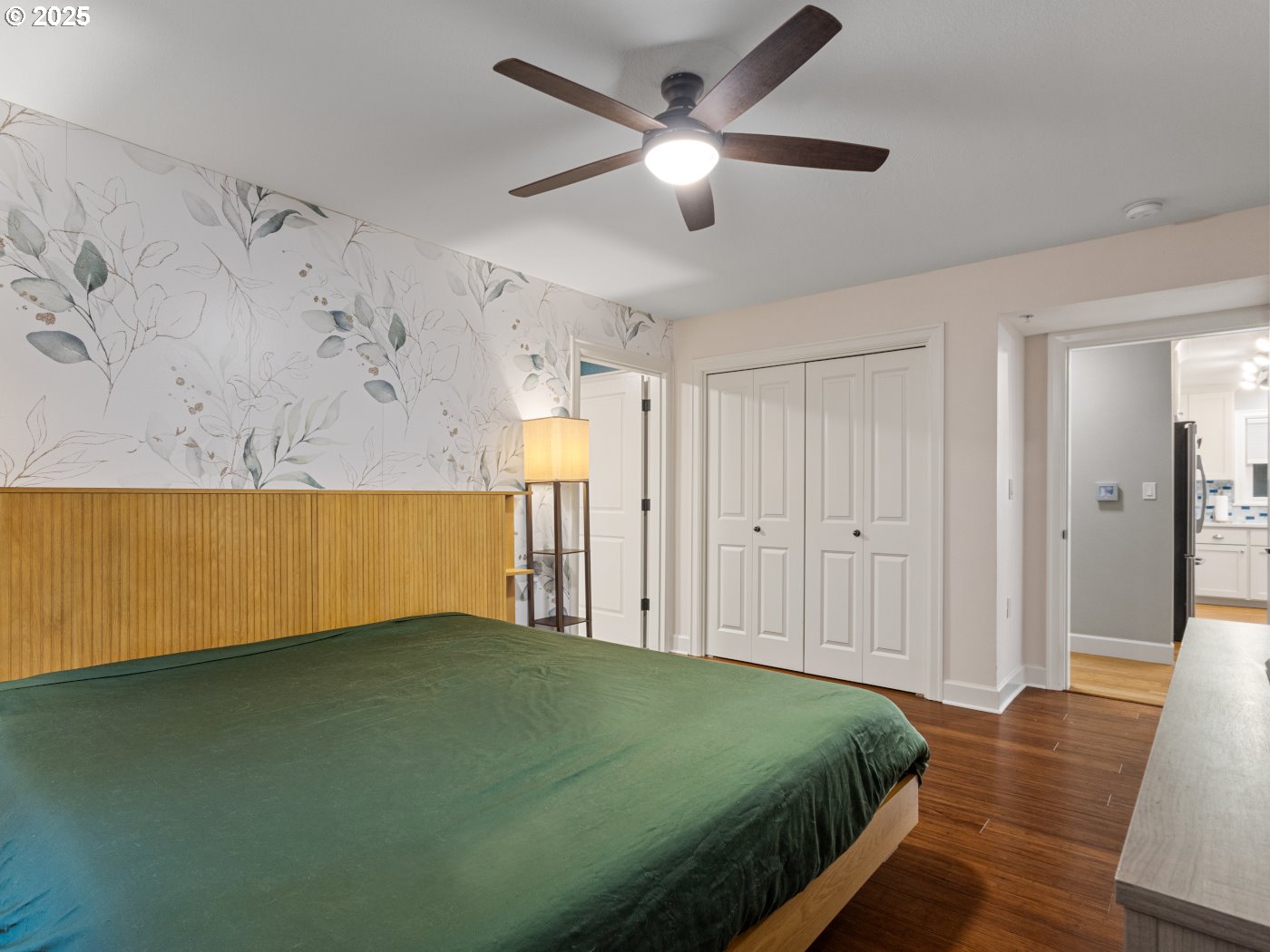 2013 Northeast 10th Avenue, Unit E Portland, OR 97212 - Photo 21 of 30 a spacious bedroom with a bed and a chandelier