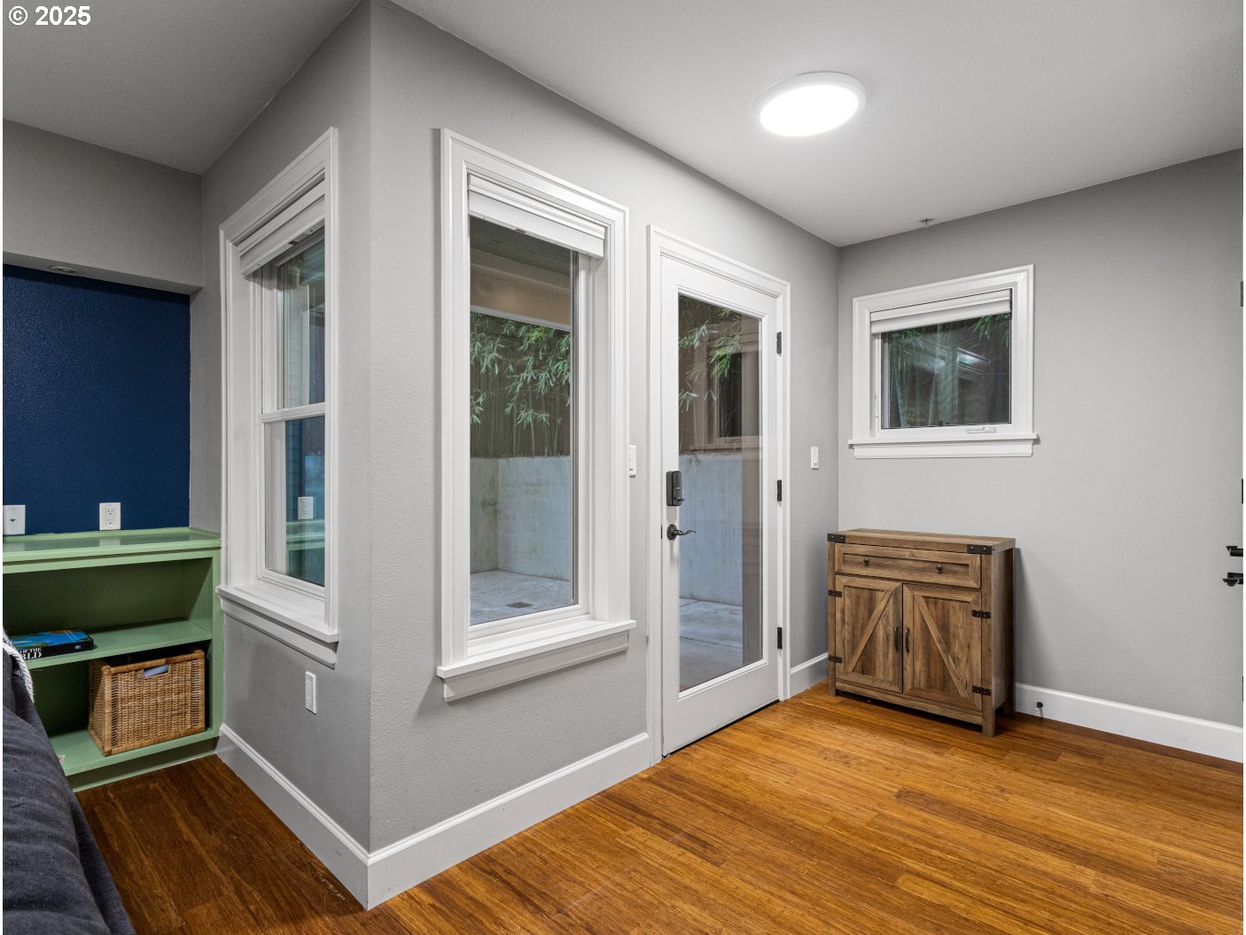 2013 Northeast 10th Avenue, Unit E Portland, OR 97212 - Photo 5 of 30 a view of a livingroom with wooden floor and furniture