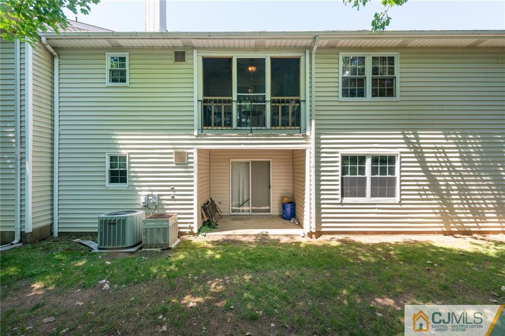 36 Hanover Square, Unit E Middlesex, NJ 08846 - Photo 20 of 23 a view of a house with a yard
