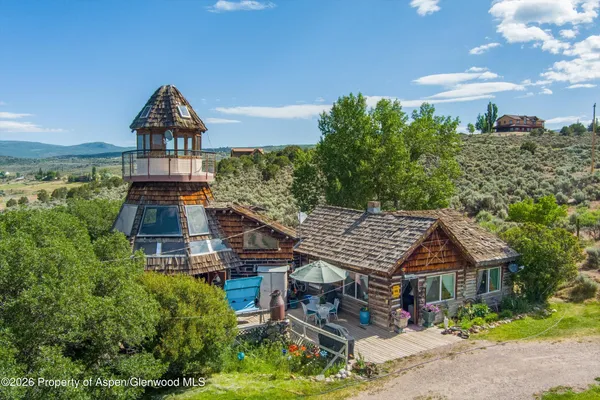 a aerial view of a house with a yard