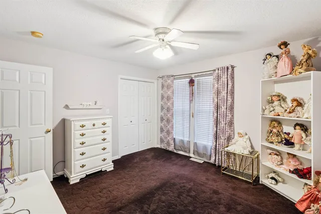 a view of livingroom with furniture and workspace