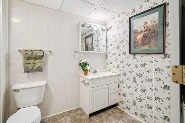 a bathroom with a toilet a sink and a shower