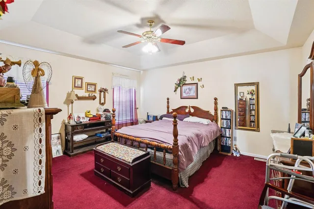 a bed room with a bed and a couch