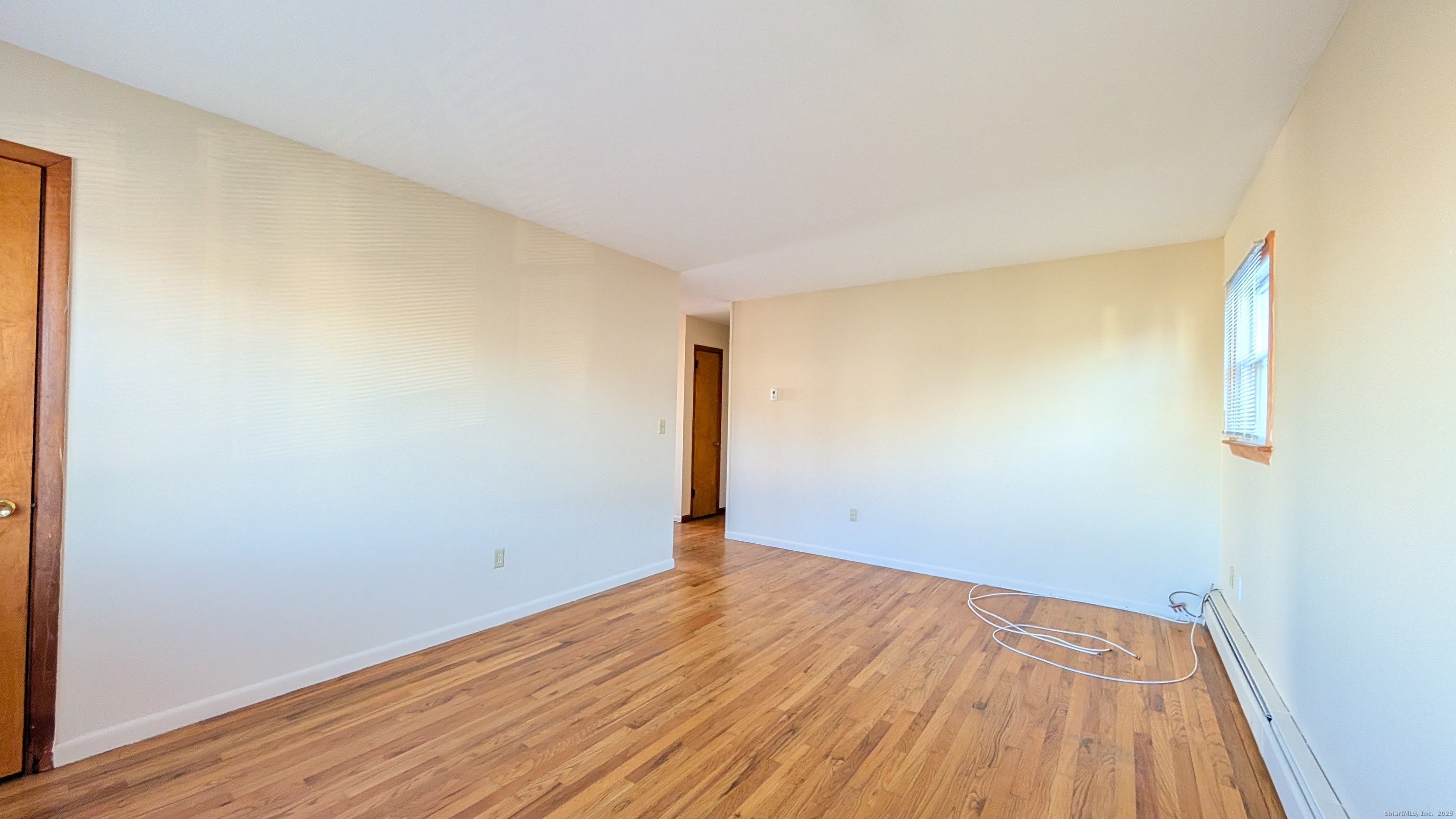 24 Hoyt Street, Unit 2 Danbury, CT 06810 - Photo 11 of 20 wooden floor in a empty room