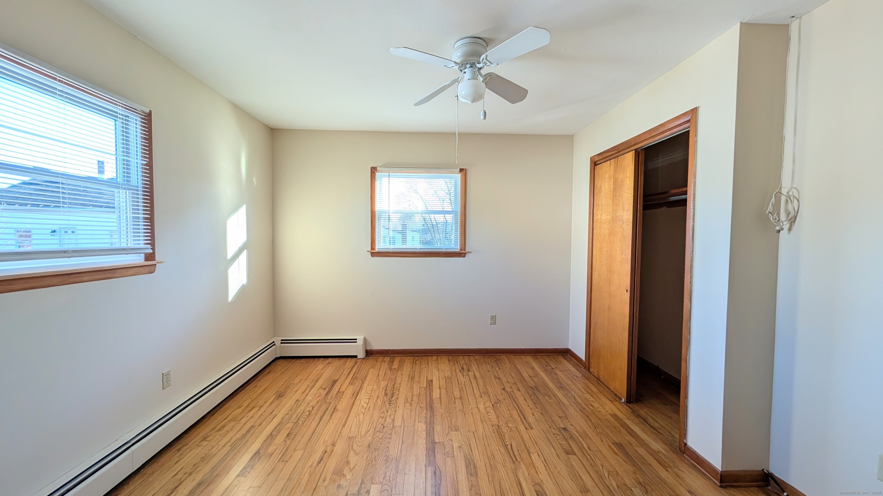 24 Hoyt Street, Unit 2 Danbury, CT 06810 - Photo 15 of 20 wooden floor in an empty room with a window