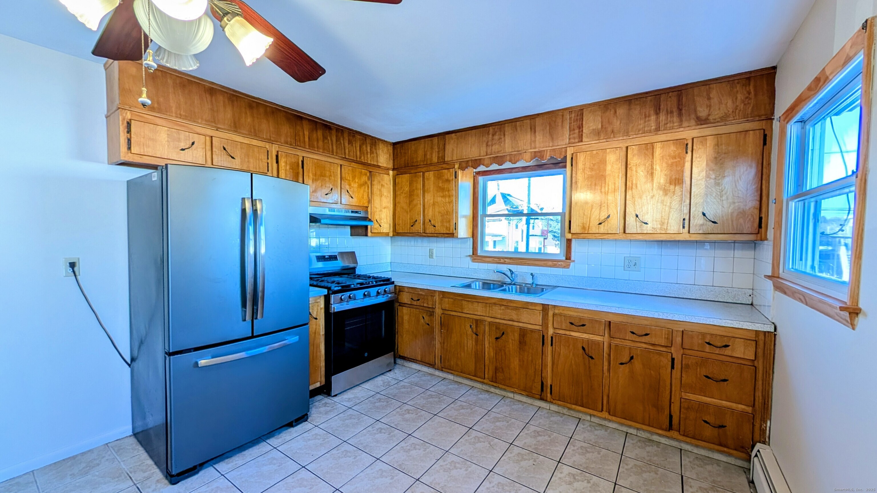 24 Hoyt Street, Unit 2 Danbury, CT 06810 - Photo 5 of 20 a kitchen with stainless steel appliances granite countertop a refrigerator and a sink