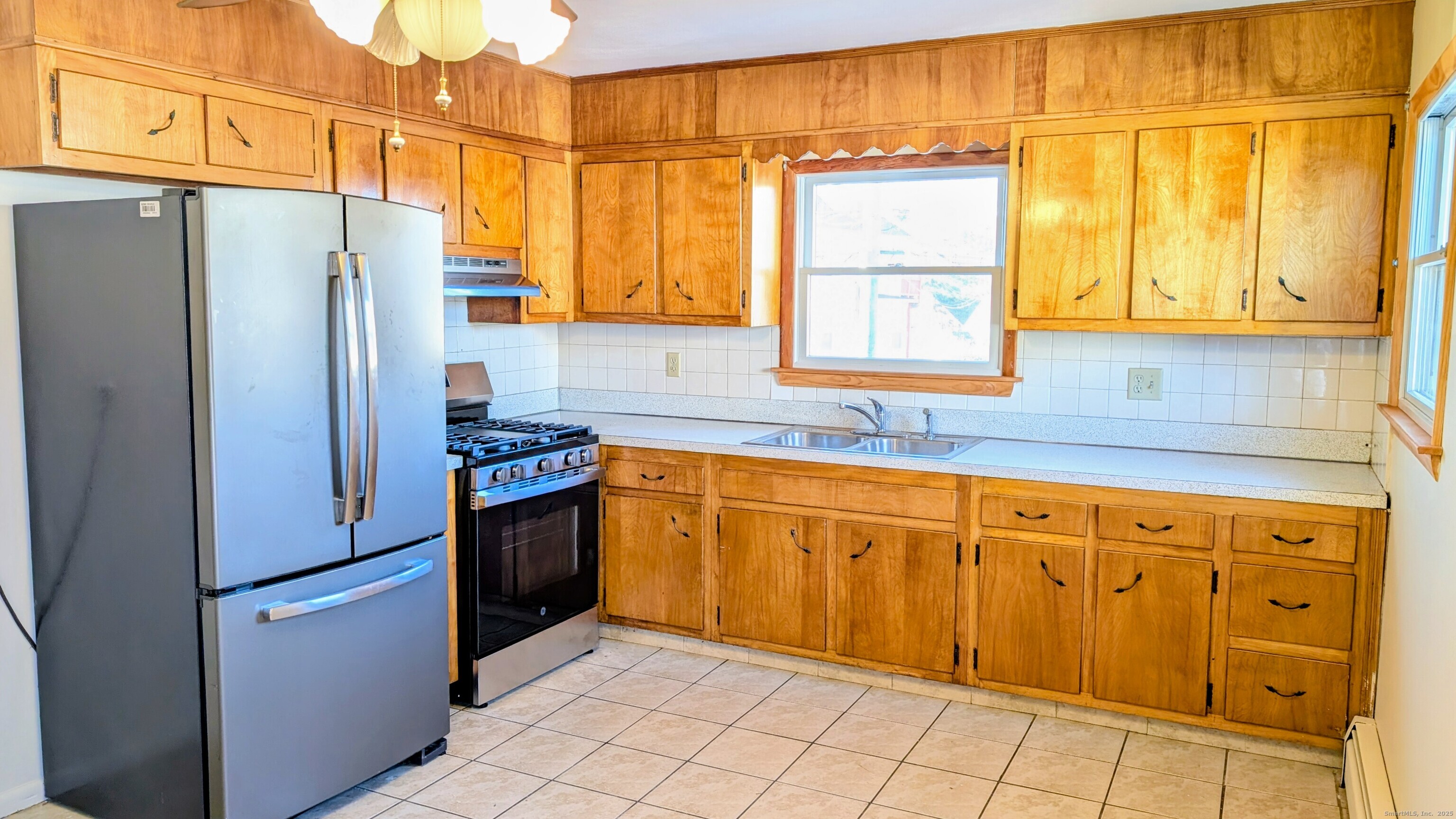 24 Hoyt Street, Unit 2 Danbury, CT 06810 - Photo 6 of 20 a kitchen with stainless steel appliances granite countertop a refrigerator and a sink