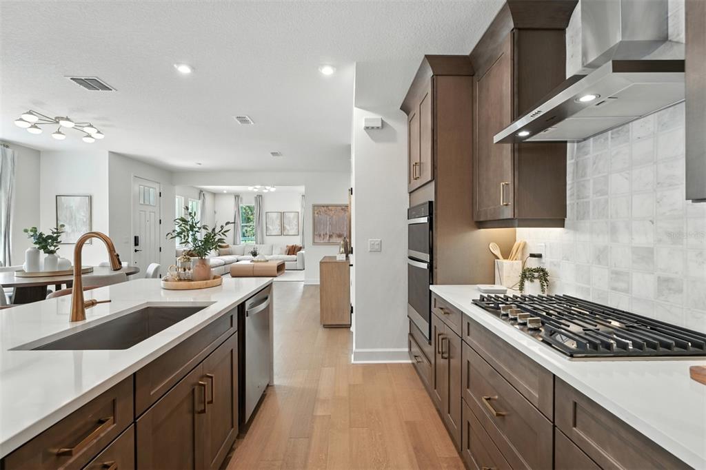 1752 Headland Loop Celebration, FL 34747 - Photo 12 of 31 a kitchen with a sink stove and cabinets