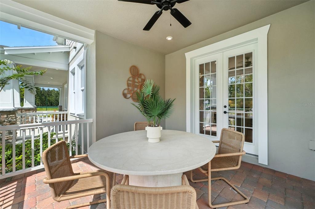 1752 Headland Loop Celebration, FL 34747 - Photo 13 of 31 a view of a dining room with furniture and a potted plant
