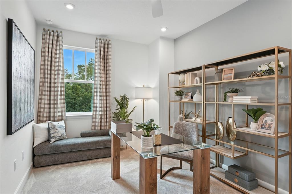 1752 Headland Loop Celebration, FL 34747 - Photo 18 of 31 a living room with furniture a table and a large window