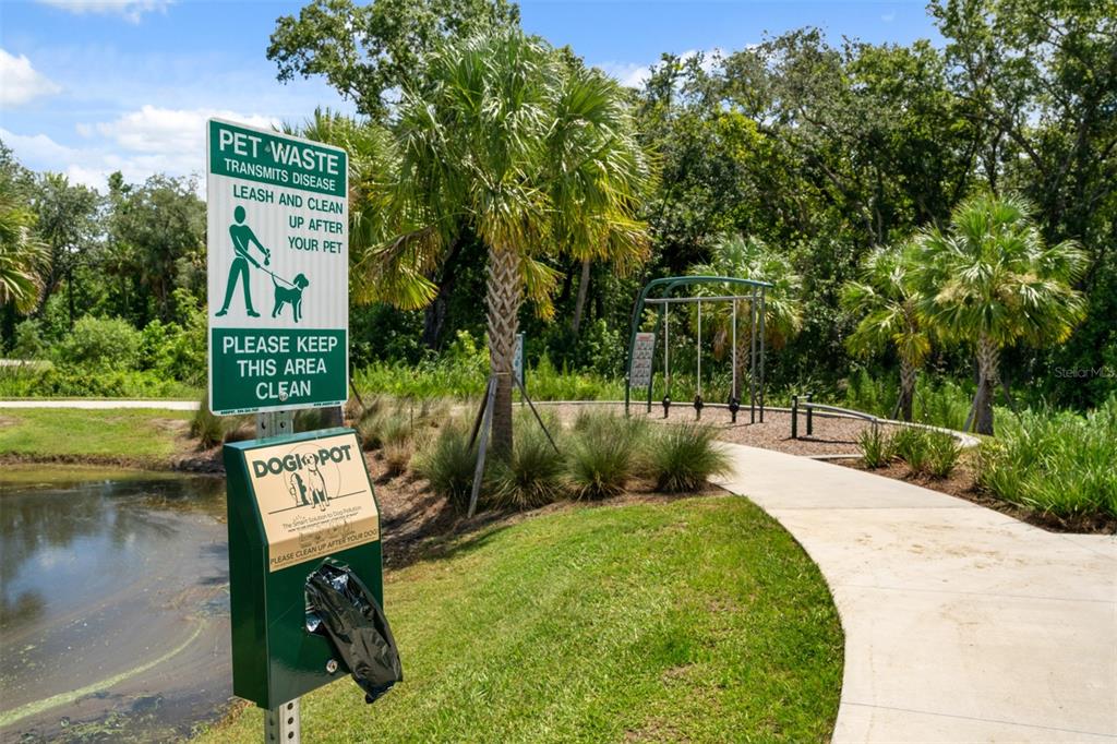 1752 Headland Loop Celebration, FL 34747 - Photo 27 of 31 a view of a bench in a garden