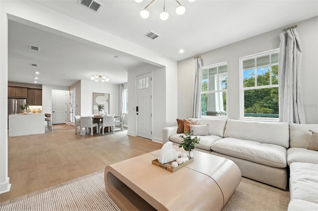 1752 Headland Loop Celebration, FL 34747 - Photo 9 of 31 a living room with furniture and a large window