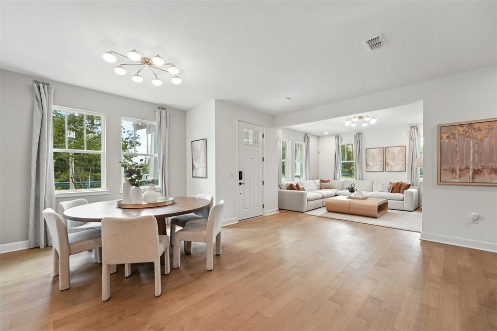 1752 Headland Loop Celebration, FL 34747 - Photo 10 of 31 a view of a dining room with furniture window and outside view