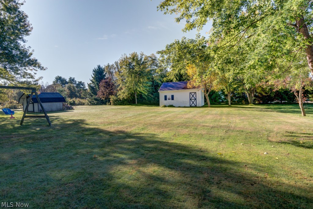 3902 Everett Road Richfield, OH 44286 - Photo 24 of 24 Large rear yard with shed! Last, but not least, the lower level is partly finished. It has a recreation room that’s ideal for playing pool. There’s also a large storage and utility area for storing holiday decor and all your seasonal items not currently in use. This is a fabulous home -- don't let it get past you!