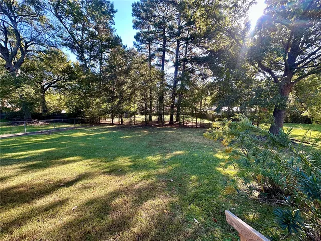 a view of a field with a trees