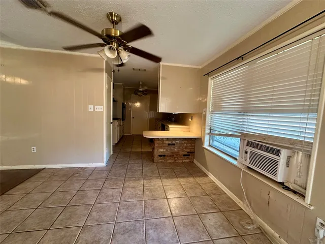 a kitchen with a sink cabinets and appliances