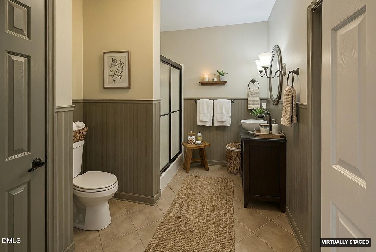 2733 Will Lucas Road Spring Lake, NC 28390 - Photo 11 of 25 a bathroom with a toilet sink and mirror